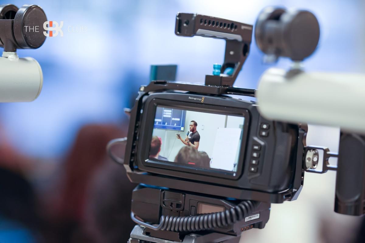 A founder pitch captured on camera at a 9K Club gathering